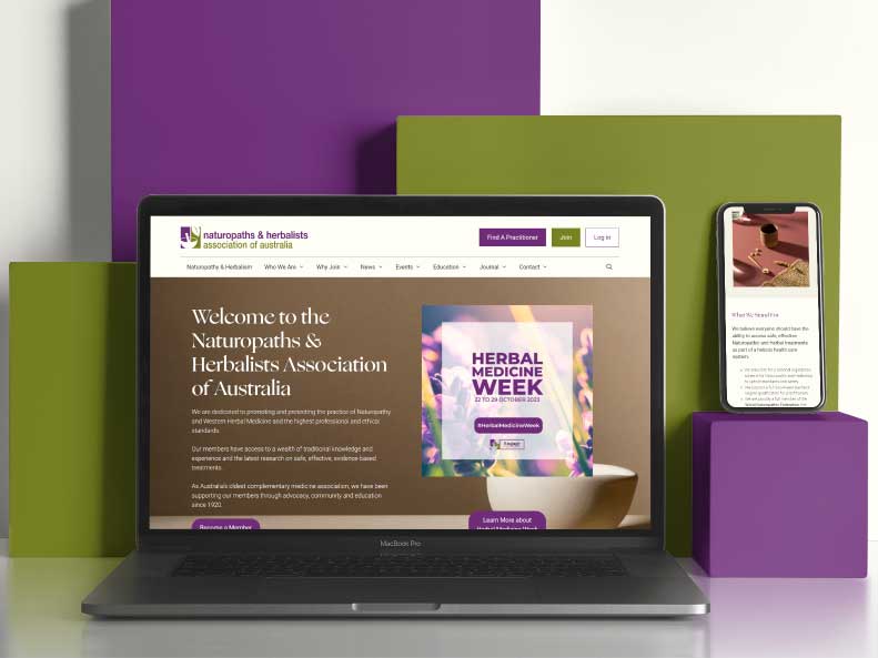 A laptop and smartphone displaying the Naturopaths & Herbalists Association of Australia website showcase elegant web design, featuring information on Herbal Medicine Week. The devices are set against green and purple block backgrounds, highlighting the site's vibrant aesthetic.